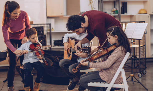 istock Kids in music school having reghearsal 1048436090