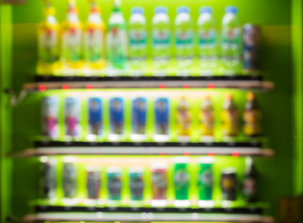 istock Blurred / Defocused abstract background of colorful soft drinks / juice bottles vending machines, taken in Thailand 1048436718