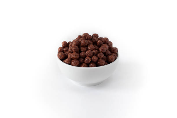 istock Corn Flakes Chocolate Balls in the Bowl Isolated Top View on White Background 1048441318