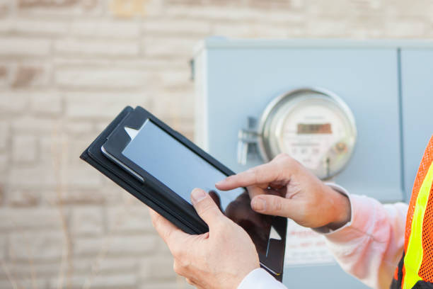 istock Tablet Computer being used to Collect Electricity Meter Information 1048442258
