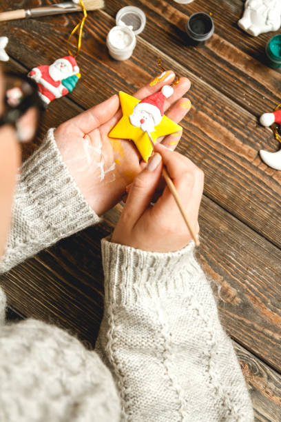 istock Woman create stylish christmas gifts 1048444664
