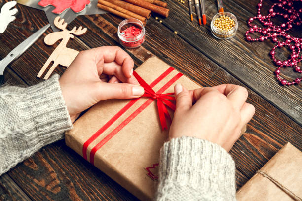 istock Woman create stylish christmas gifts 1048447400