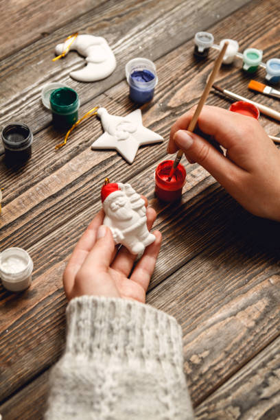 istock Woman create stylish christmas gifts 1048451108