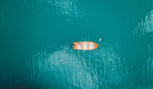 istock Dinghy on blue lake in Norway. 1048453940