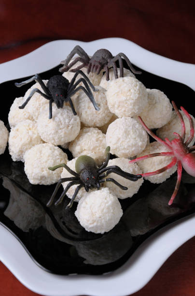 waffle balls in coconut flakes in the form of spider eggs on halloween - eggs animal egg stack stacking imagens e fotografias de stock