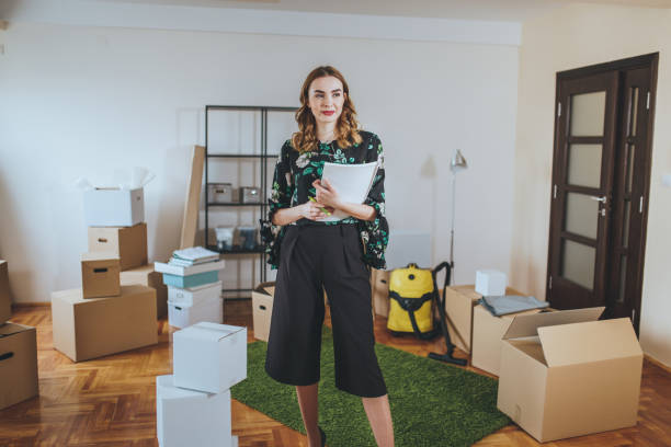 istock Beautiful real estate agent hosting a open house 1048457714