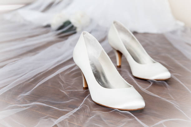 istock Wedding shoes with veil 1048464730
