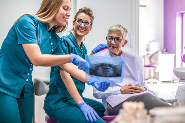 istock Woman Dentist with patient 1048467662