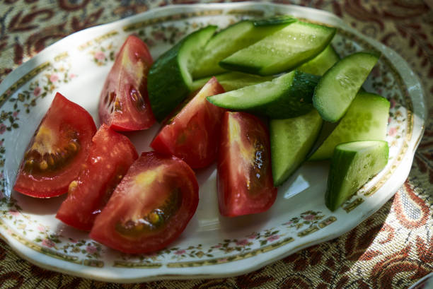 istock sliced fresh vegetable salad with tomatoes and cucumber 1048477614