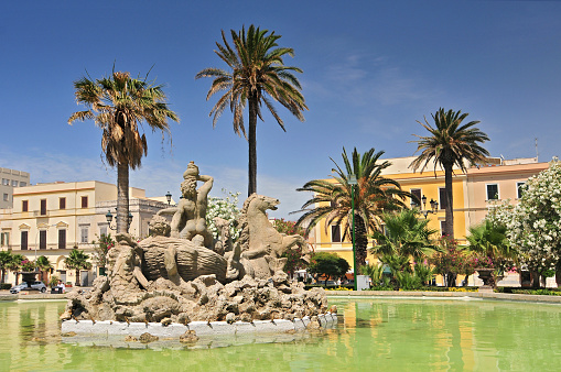 Triton fountain on the Piazza Vittorio Emanuele II in Trapani, Sicily, Italy.