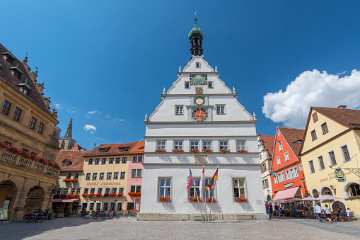 Ratstrinkstube facade with clock, data, coat of arms and sun dial in Rothenburg ob der Tauber, Franconia, Bavaria, Germany.