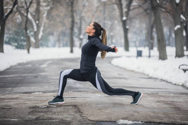 istock Girl exercise on winter day 1048498022