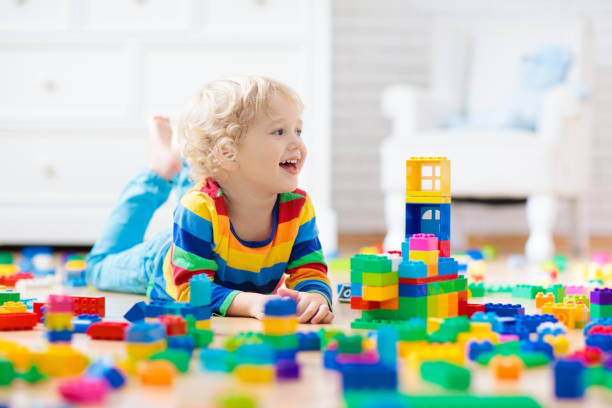 istock Child playing with toy blocks. Toys for kids. 1048500084