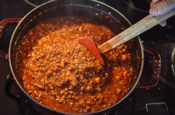 istock Stirring bolognese sauce in a pot 1048506834