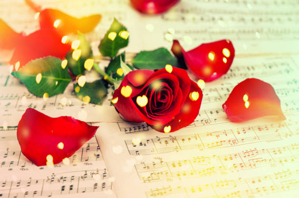 istock Red rose flower Music notes sheet Hearts vintage 1048506910