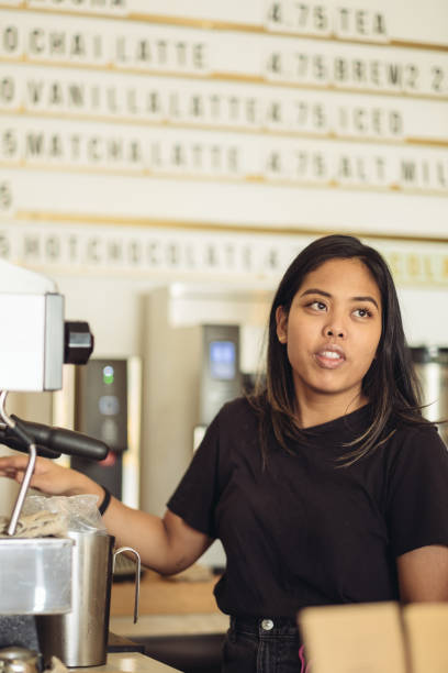 istock Young female Barista making coffee 1048509780