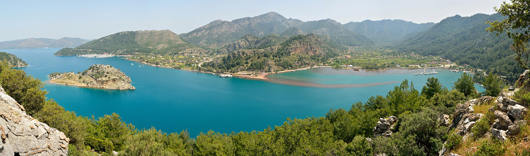 Panoramic view over Orhaniye bay, with Orhaniye village and Kizkumu beach, on Bozburun peninsula near Marmaris resort town in Turkey.