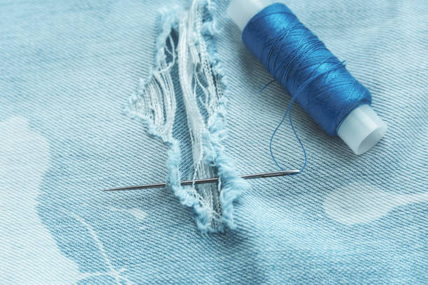 istock composition of seamstress, tailor, thread for sewing and for knitting 1048520438