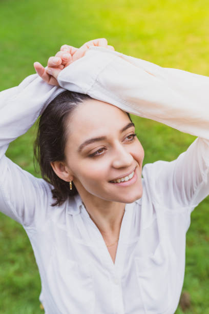 istock Smiling woman with sunset in the background 1048548210