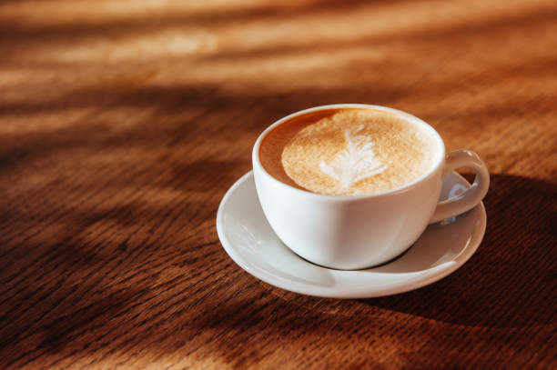 istock coffee cup latte art in cafe 1048554052
