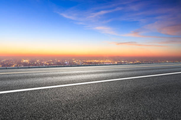 istock Modern city skyline and buildings with empty asphalt road 1048564980