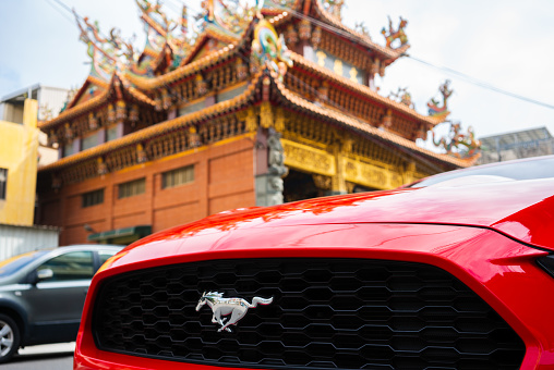 16 February 2018, Lukang Changhua Taiwan : Ford Mustang car grille and logo with temple background