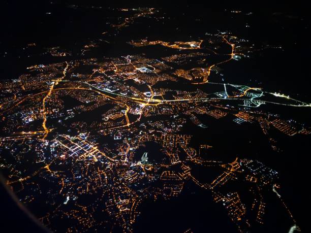 istock mobile camera image capture from the window viewpoint inside airplane showing night cityscape 1048576556