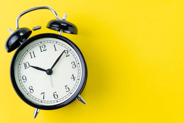 istock Time, deadline or reminder concept, vintage ringing black alarm clock with white face on yellow background in flat lay or top view, studio shot with copy space 1048576764