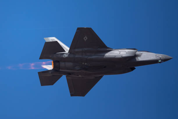 istock The every distinctive shape of  a F-35 Lightning II  with afterburner on ( very close  bottom view) 1048580066