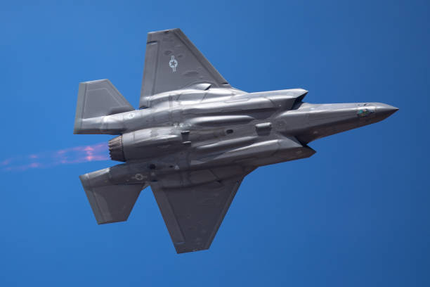 istock The every distinctive shape of  a F-35 Lightning II  with afterburner on ( very close  bottom view) 1048580094