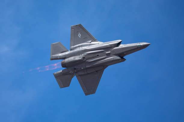 istock The every distinctive shape of  a F-35 Lightning II  with afterburner on ( very close  bottom view) 1048580122