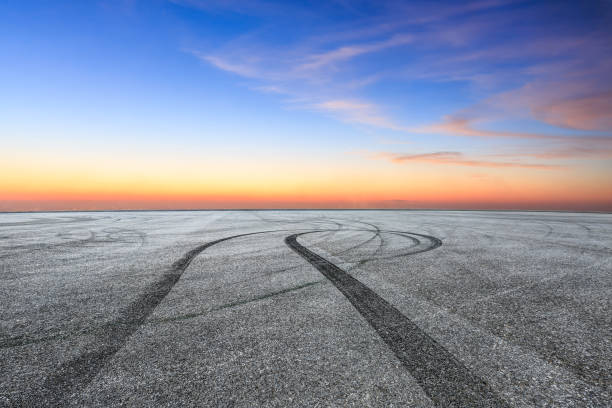 istock Car racing track and beautiful sky clouds 1048580186