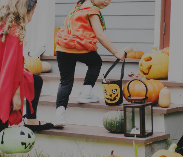 istock Little children trick or treating 1048600860