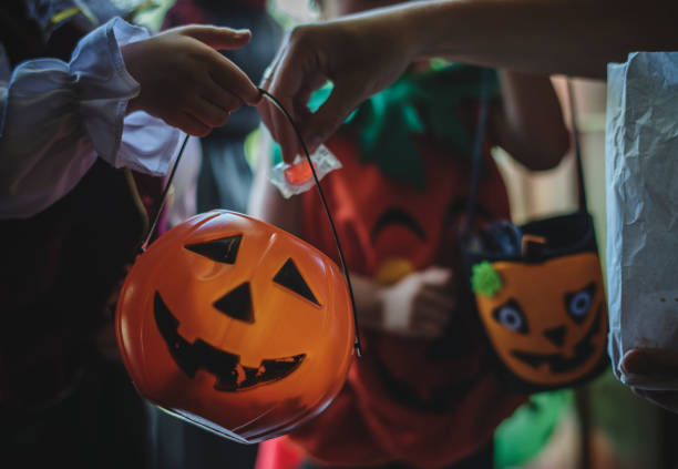 istock Little children trick or treating on Halloween 1048600930