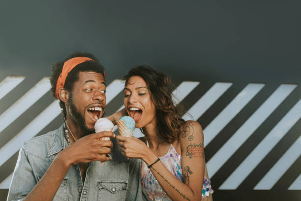 Cheerful couple enjoying ice cream