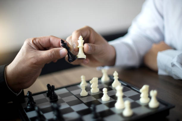 istock Businessman thinking how to play chess concept business strategy 1048613610