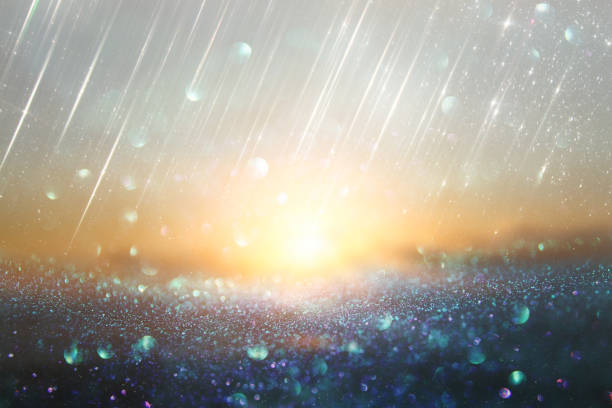 istock glitter vintage lights background. silver, gold and blue. de-focused. 1048619366