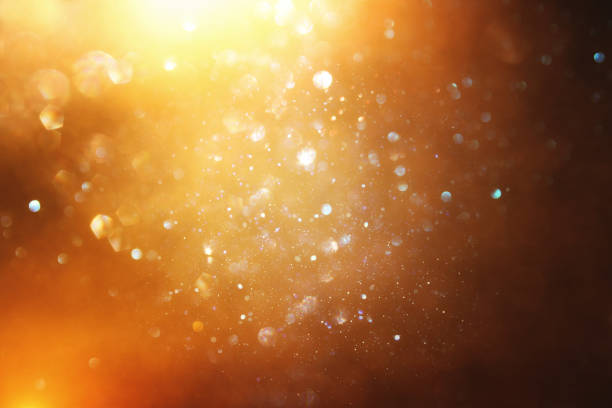 istock glitter vintage lights background. black and gold. de-focused. 1048619368
