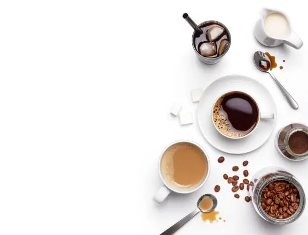 Photo of Different types of coffee and ingredients over white background with copy space