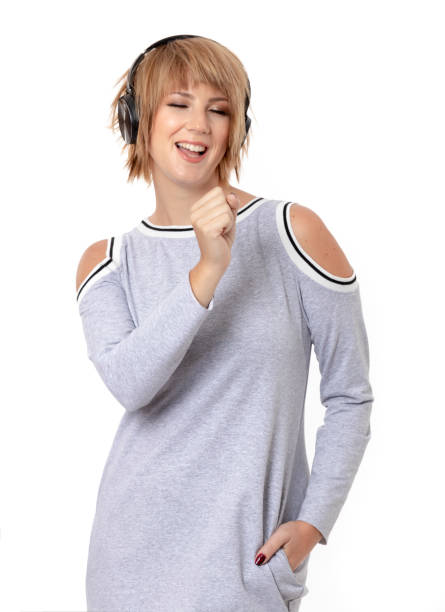 istock Young singing along while listening to music 1048632828