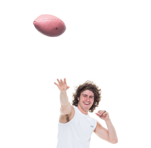 istock Man holding football 1048635400