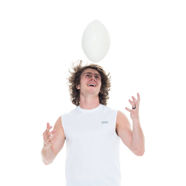 istock Man holding rugby ball 1048635402