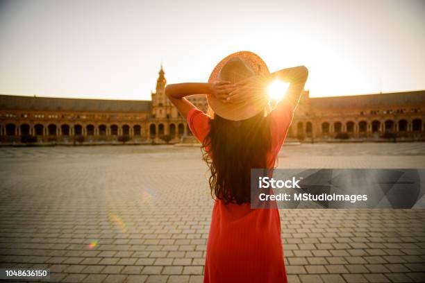 Woman Enjoying Sunrise Stock Photo - Download Image Now - Seville, Andalusia, Spain