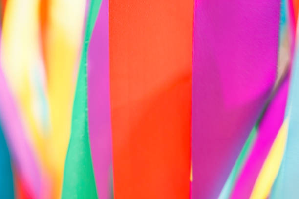 istock Multicolored silk ribbons are heard in the wind. Background image. 1048641002