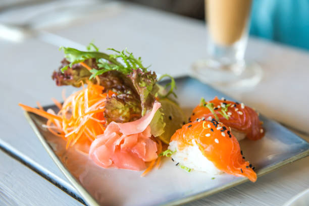 istock Salmon Nigiri with fresh salad 1048644304