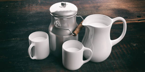 3d rendering can, jug and cups with milk on wooden background