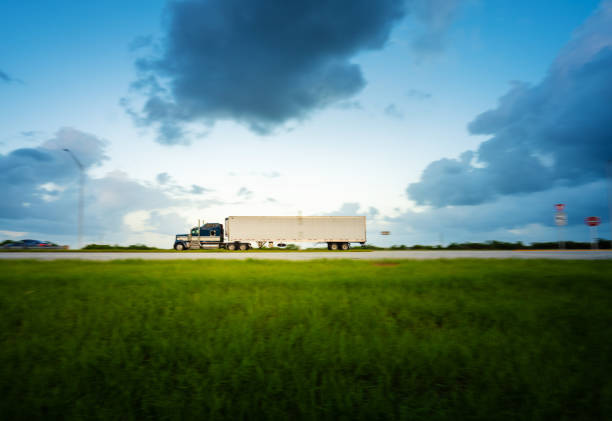 istock Truck on the highway panning motion 1048647396