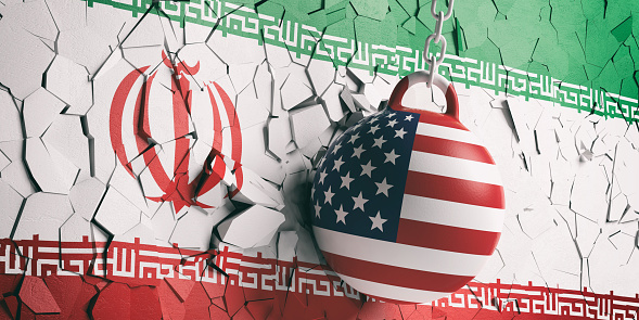 US of America and Iran relations. USA flag wrecking ball breaking a Iran flag wall. 3d illustration