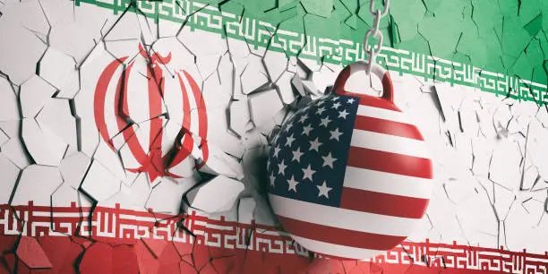 Photo of USA flag wrecking ball breaking a Iran flag wall. 3d illustration