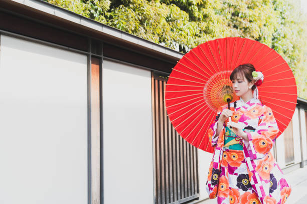 istock Young asian girl wearing kimono (Japanese traditional clothes). 1048650400